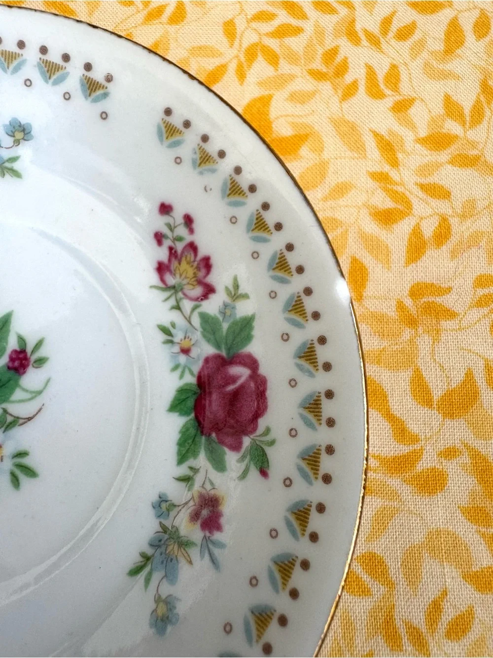 Vintage Espresso Cup and Matching Saucer. White Porcelain with Floral Motif.